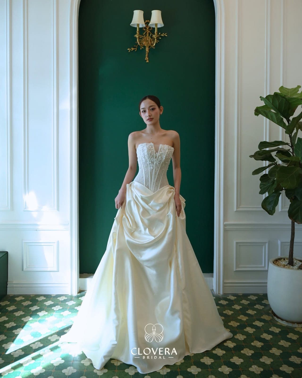 A Clovera gown displayed against the showroom wall